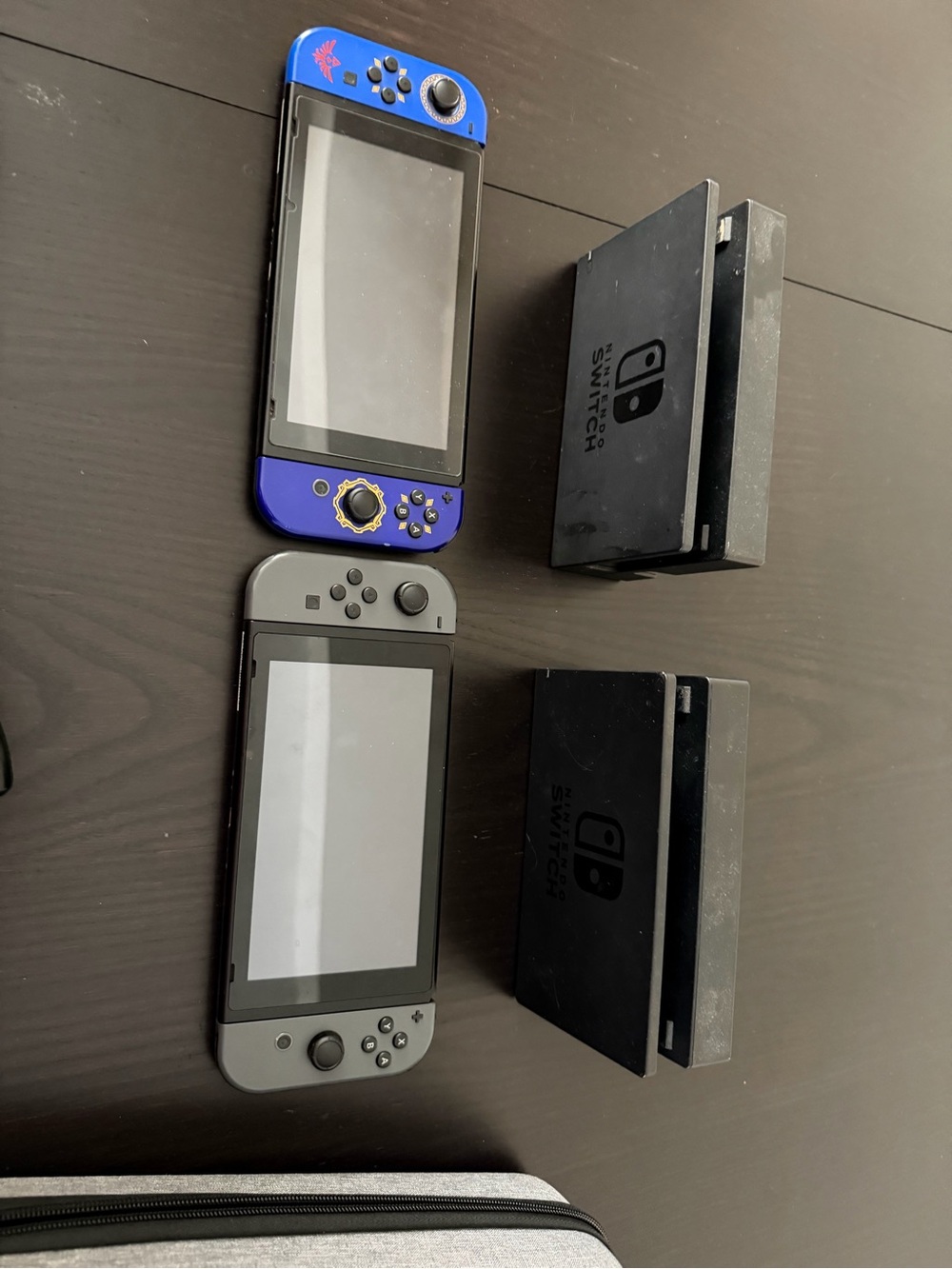 Nintendo Handheld Console Pair with Blue Accent and Gray Unit